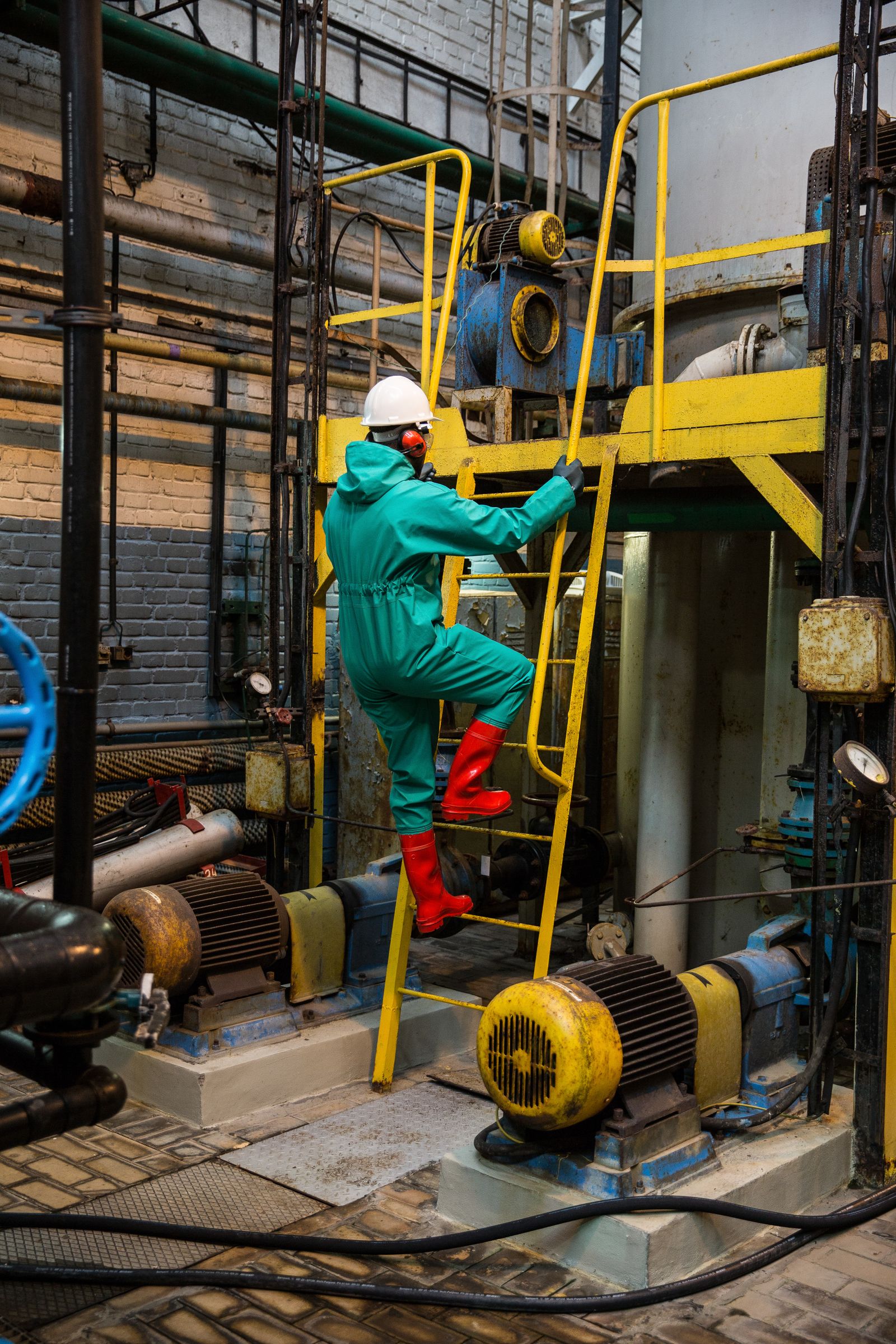 Industrial engineers on site in protective equipment